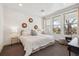 Inviting bedroom featuring plush bedding, ample natural light, and contemporary decor elements at 2851 W 52Nd Ave # 208, Denver, CO 80221