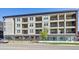Modern apartment building showcasing multiple balconies and contemporary architecture at 2851 W 52Nd Ave # 208, Denver, CO 80221