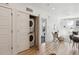 Convenient in-unit laundry closet with a stackable washer and dryer for easy chore management at 2851 W 52Nd Ave # 208, Denver, CO 80221