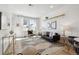 Stylish living room with a comfortable leather sofa, modern furnishings, and plenty of natural light at 2851 W 52Nd Ave # 208, Denver, CO 80221