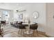 Bright living and dining area featuring modern furniture, stylish decor, and a welcoming atmosphere at 2851 W 52Nd Ave # 208, Denver, CO 80221