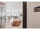 Bright, open-concept living space with light wood floors, modern furnishings, and plenty of natural light at 2851 W 52Nd Ave # 208, Denver, CO 80221