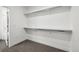 A spacious walk-in closet with rod and shelf offering ample storage space at 2851 W 52Nd Ave # 208, Denver, CO 80221