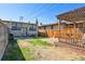 Fenced backyard area featuring green space, patio, and privacy at 3946 Perry St, Denver, CO 80212