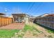 Well maintained backyard with grass and a wooden deck and pergola at 3946 Perry St, Denver, CO 80212