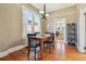 Charming dining room with hardwood floors, modern lighting and lots of natural light at 3946 Perry St, Denver, CO 80212