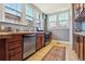 Kitchen featuring stainless appliances, butcher block countertops, and neutral paint at 3946 Perry St, Denver, CO 80212