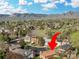 Aerial shot of a neighborhood with mountain views featuring the home with solar panels at 2250 S Zang Ct, Lakewood, CO 80228