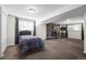 Finished basement featuring a bedroom area, a stone fireplace, and ample living space at 2250 S Zang Ct, Lakewood, CO 80228