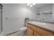 Clean bathroom featuring modern vanity, a large mirror, and shower with sliding glass door at 2250 S Zang Ct, Lakewood, CO 80228
