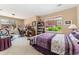Bedroom space for both sleeping and home office with bookshelves and large windows to let in light at 8595 Gold Peak Dr # A, Highlands Ranch, CO 80130
