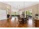 Hardwood floor dining room leads into a living area and a view of an outdoor patio at 8595 Gold Peak Dr # A, Highlands Ranch, CO 80130