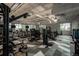 Bright fitness center with exercise equipment, large windows, and an open layout at 8595 Gold Peak Dr # A, Highlands Ranch, CO 80130