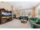 Cozy living room with a fireplace, comfortable seating, and large windows at 8595 Gold Peak Dr # A, Highlands Ranch, CO 80130