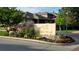 A welcoming sign with colorful flowers marks the entrance to Gold Peak community at 8595 Gold Peak Dr # A, Highlands Ranch, CO 80130