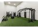 Training area equipped with weights, heavy bags, and turf flooring at 8595 Gold Peak Dr # A, Highlands Ranch, CO 80130