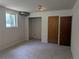 This remodeled basement room features new carpet and includes dual closets for storage at 1251 Lee St, Lakewood, CO 80215