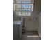 Laundry room with window and some upper cabinet storage at 1251 Lee St, Lakewood, CO 80215