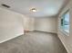 Living room with neutral walls and carpet, and large window at 3569 W 89Th Ave, Westminster, CO 80031