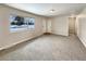 Bright and airy living room with neutral carpeting and large windows at 3569 W 89Th Ave, Westminster, CO 80031