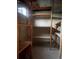 Unfinished basement featuring built in shelving units at 2995 S Whiting Way, Denver, CO 80231