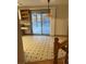 Kitchen leading to outdoor deck with sliding glass doors, features tiled flooring, and ample natural light at 2995 S Whiting Way, Denver, CO 80231