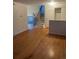 Spacious living room with hardwood floors, featuring a staircase leading to the upper level, and a bright, open layout at 2995 S Whiting Way, Denver, CO 80231