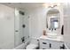 Clean bathroom with white subway tile and a marble vanity at 1415 E 16Th Ave # 1/2, Denver, CO 80218