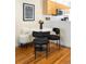 Modern dining area with a marble table and kitchen view at 1415 E 16Th Ave # 1/2, Denver, CO 80218