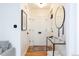 Modern entry hall with white walls and hardwood floors at 1415 E 16Th Ave # 1/2, Denver, CO 80218