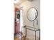 Bright entryway with a glass-top console table and mirror at 1415 E 16Th Ave # 1/2, Denver, CO 80218