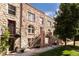 Stone exterior of a charming multi-unit building with well-maintained landscaping at 1415 E 16Th Ave # 1/2, Denver, CO 80218