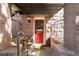Inviting front entrance with a red door and stone accents at 1415 E 16Th Ave # 1/2, Denver, CO 80218