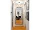 Bright hallway with arched mirror reflecting a dining area at 1415 E 16Th Ave # 1/2, Denver, CO 80218