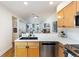 Modern kitchen with stainless steel appliances and light wood cabinets at 1415 E 16Th Ave # 1/2, Denver, CO 80218