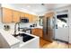 Modern kitchen with stainless steel appliances and light wood cabinets at 1415 E 16Th Ave # 1/2, Denver, CO 80218