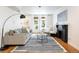 Bright living room features a fireplace, modern decor, hardwood flooring, and lots of natural light at 1415 E 16Th Ave # 1/2, Denver, CO 80218