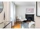 Cozy living room featuring a fireplace and comfy seating at 1415 E 16Th Ave # 1/2, Denver, CO 80218