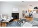 Open living room with hardwood floors and a view to the kitchen at 1415 E 16Th Ave # 1/2, Denver, CO 80218