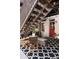 Private patio with bistro set and geometric patterned rug at 1415 E 16Th Ave # 1/2, Denver, CO 80218