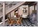 Cozy brick patio with seating area, small table, and grill at 1415 E 16Th Ave # 1/2, Denver, CO 80218