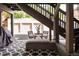 Private patio with bistro set and view of garages at 1415 E 16Th Ave # 1/2, Denver, CO 80218