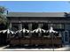 White Pie restaurant with striped umbrellas and outdoor seating at 1415 E 16Th Ave # 1/2, Denver, CO 80218