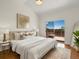 Bright bedroom boasts a high ceiling, deck access, and stylish decor, creating a relaxing atmosphere at 12335 E 2Nd Dr, Aurora, CO 80011