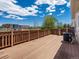 Open deck with wood flooring offers spacious area for lounging and outdoor enjoyment at 12335 E 2Nd Dr, Aurora, CO 80011
