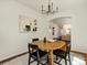 Bright dining area with modern chandelier and view of connecting rooms at 12335 E 2Nd Dr, Aurora, CO 80011