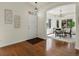 Hardwood entryway and dining area with elegant decor and plenty of natural light at 12335 E 2Nd Dr, Aurora, CO 80011