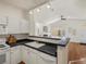 Bright kitchen with modern countertops and hardwood flooring at 12335 E 2Nd Dr, Aurora, CO 80011