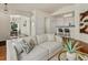 Cozy living room featuring hardwood floors and a stylish couch at 12335 E 2Nd Dr, Aurora, CO 80011