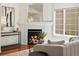 Comfortable living room with a tiled fireplace and a view of the exterior at 12335 E 2Nd Dr, Aurora, CO 80011